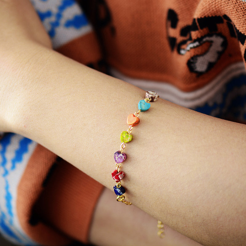 Heart Natural Stone Bracelet on wrist, featuring colorful natural stones and gold-plated copper.