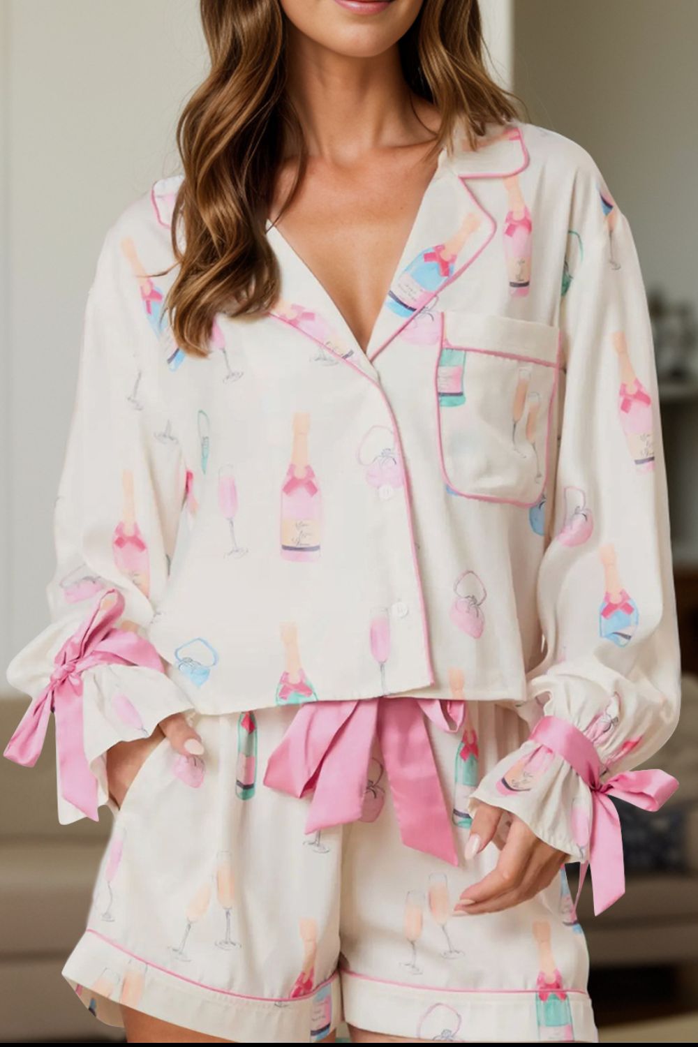 Bow printed collared neck top and drawstring shorts lounge set in pink and white.