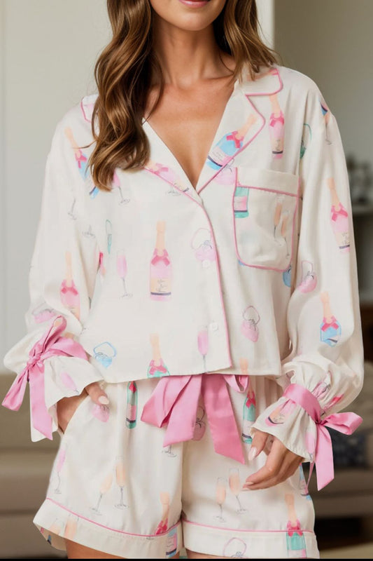 Bow printed collared neck top and drawstring shorts lounge set in pink and white.