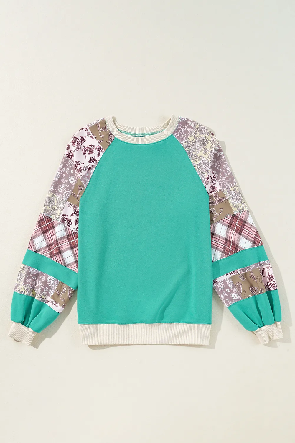 Printed round neck long sleeve blouse with colorful pattern sleeves.