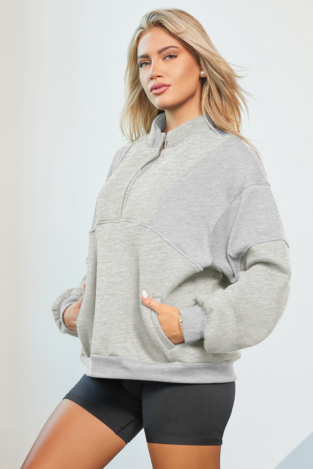 Oversized half zip dropped shoulder sweatshirt in gray with pockets.