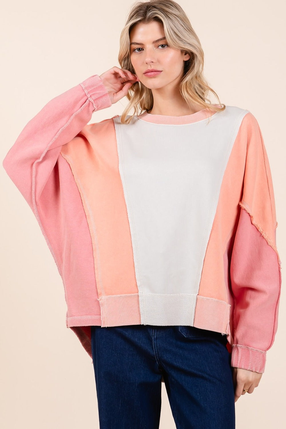 Mineral wash color block sweatshirt with dolman sleeves and exposed seams.