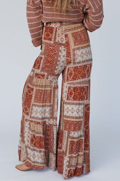 Boho wide leg high pants with drawstring, featuring an earthy pattern.