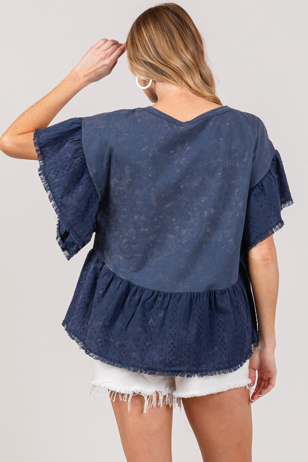 Ruffle sleeve washed short sleeve blouse in blue, featuring elegant ruffle details, worn by a model.