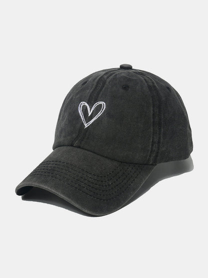 Embroidered heart washed cotton baseball cap, adjustable fit.