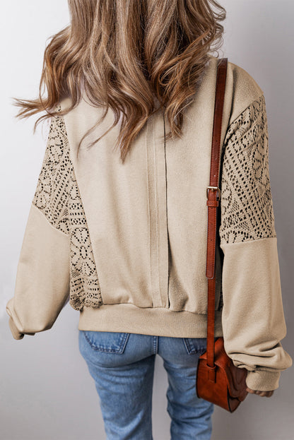 Boho crochet round neck long sleeve sweatshirt with cutout details in beige, shown from the back.