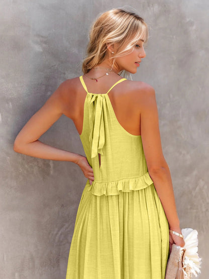 Ruffled sleeveless tiered maxi dress with pockets in yellow, featuring tied back and high-low design.