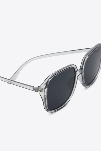 Oversized square sunglasses with UV400 protection and polycarbonate frame.