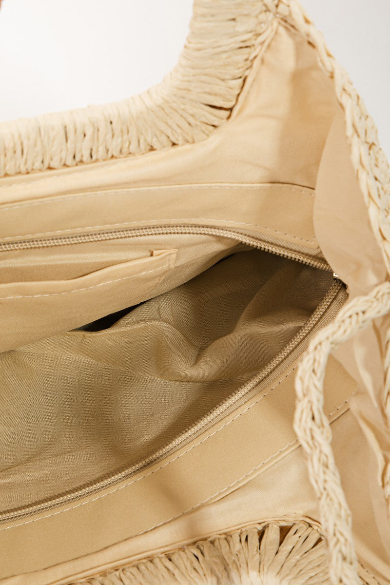 Interior view of the Color Block Convertible Braided Tote Bag showcasing braided detailing and spacious compartments.