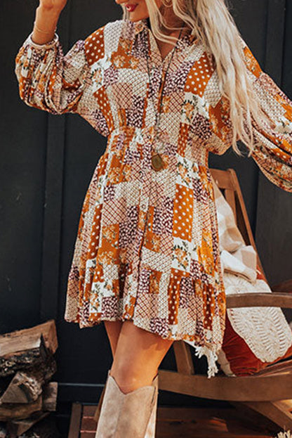 Orange boho floral puff sleeve mini dress with smocked waist and button-up design.