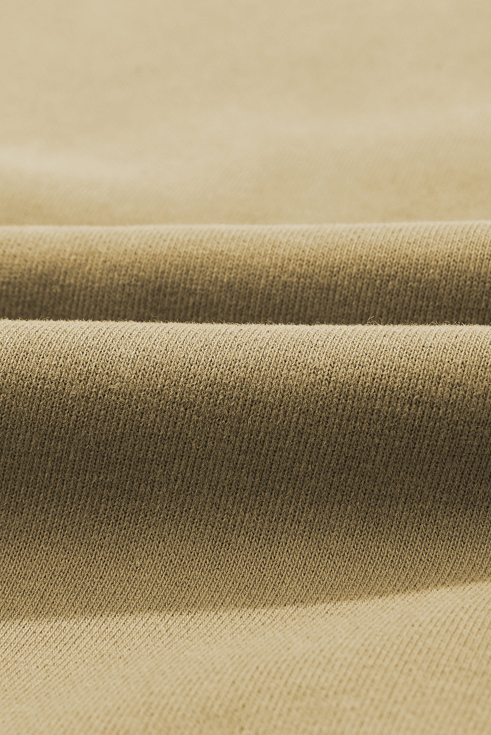 Close-up of fabric texture for Quarter-Snap Dropped Shoulder Hoodie, showcasing a blend of polyester and cotton.