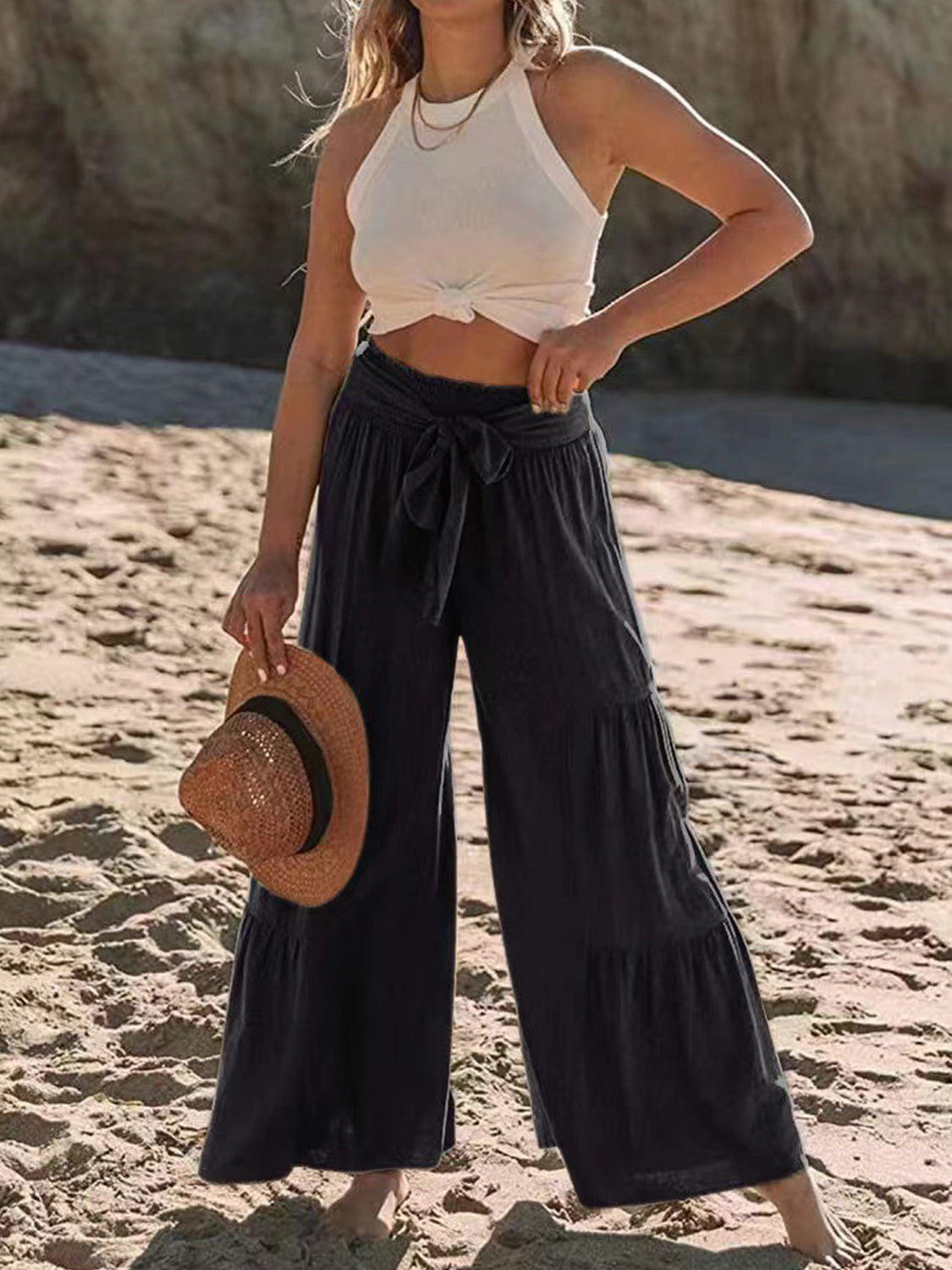 High waist tied ruched wide leg pants worn on beach, comfortable and chic.