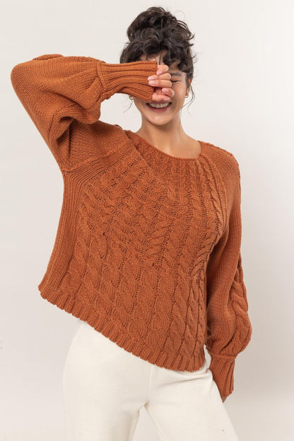 Women's cable knit round neck raglan sleeve sweater, casual fit in burnt orange color.