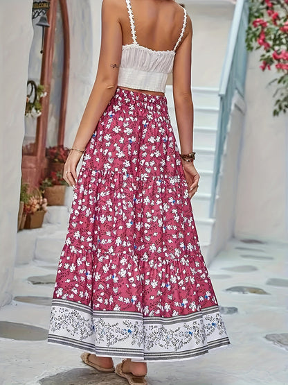 Tiered printed elastic waist skirt with floral pattern, ruched design, and opaque polyester fabric.