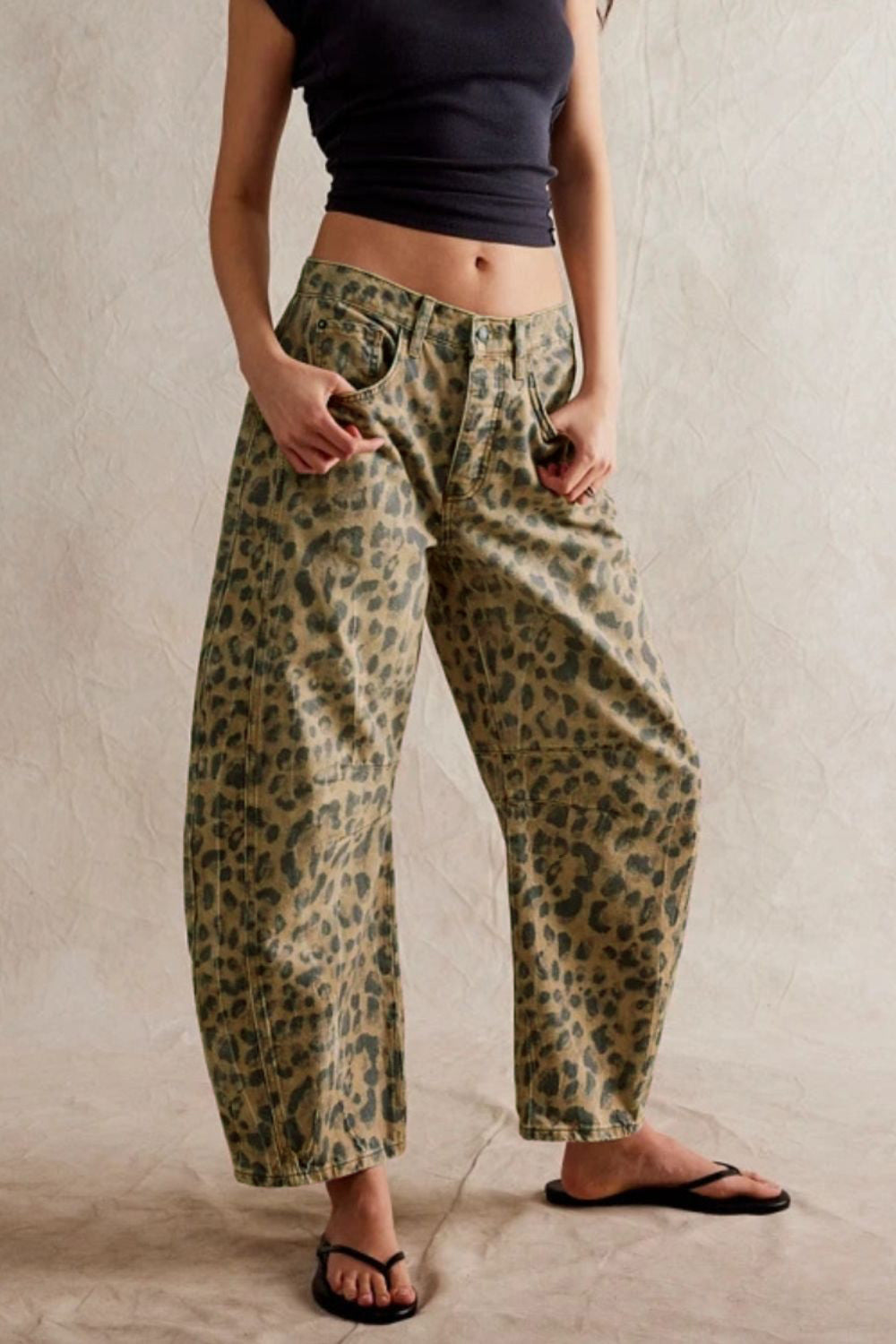 Wide leg barrel jeans with pockets, leopard print design.