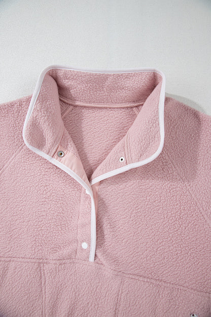 Pink half snap long sleeve fleece jacket with white trim, 100% polyester, featuring a pocket.