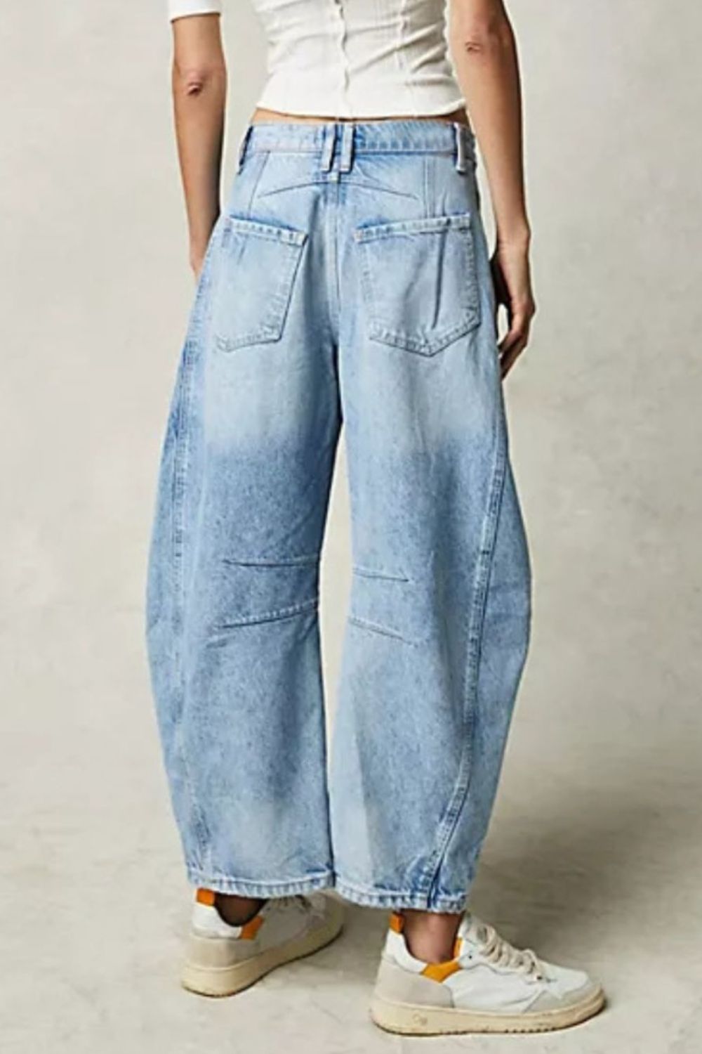 Wide leg barrel jeans with back pockets and relaxed fit.