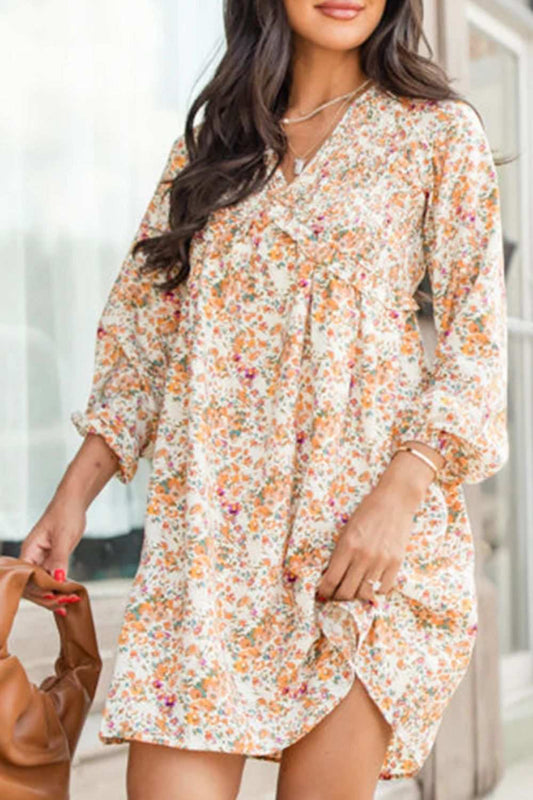 Feminine floral printed balloon sleeve mini dress in lightweight polyester fabric.