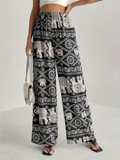 Printed wide leg elastic waist pants with elephant design pattern.