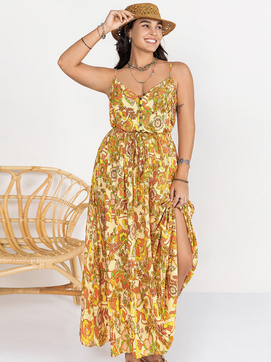 Plus size printed V-neck maxi cami dress with buttoned front, sleeveless design, and vibrant pattern.