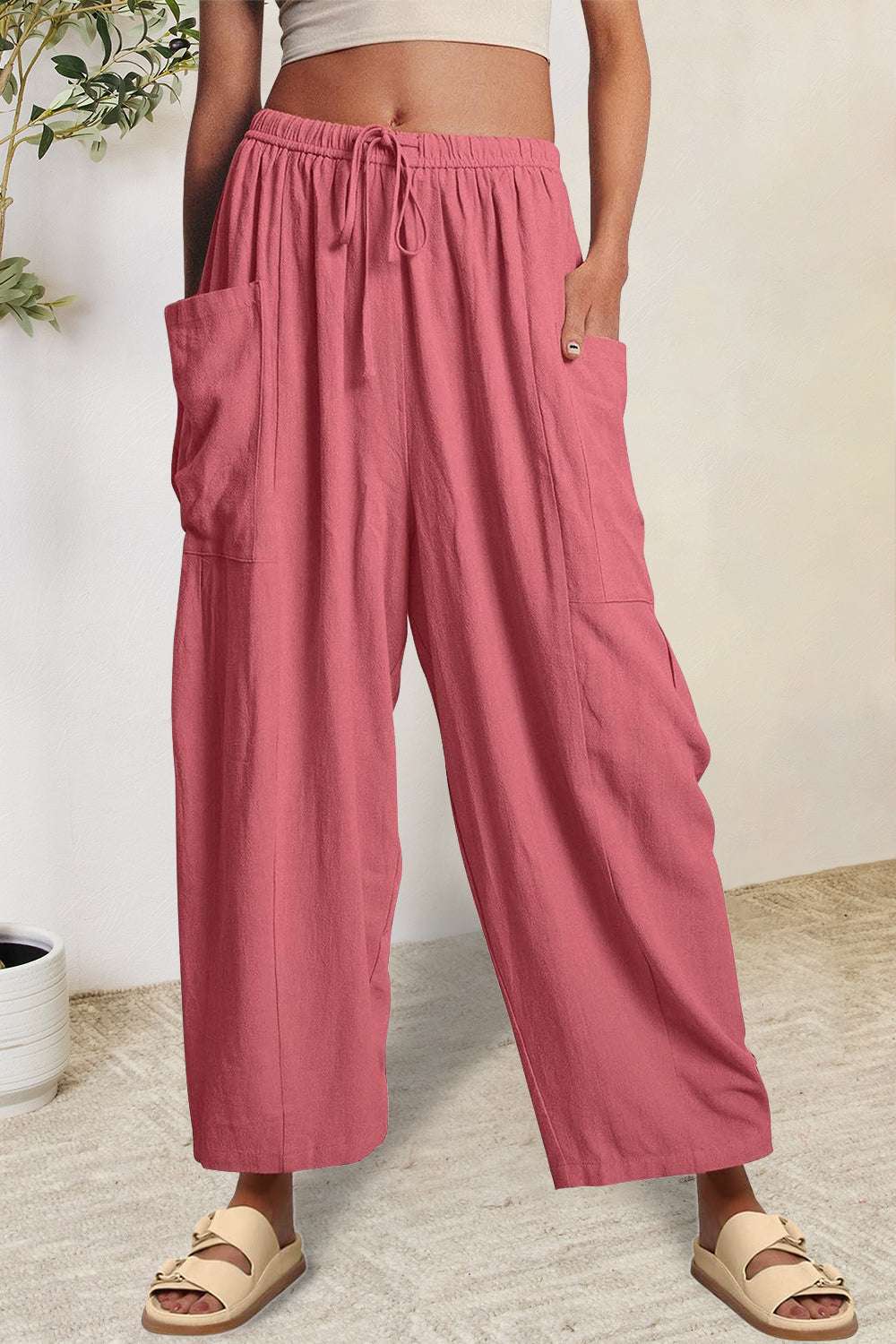 Boho wide leg harem pants with pockets in pink, 100% polyester.