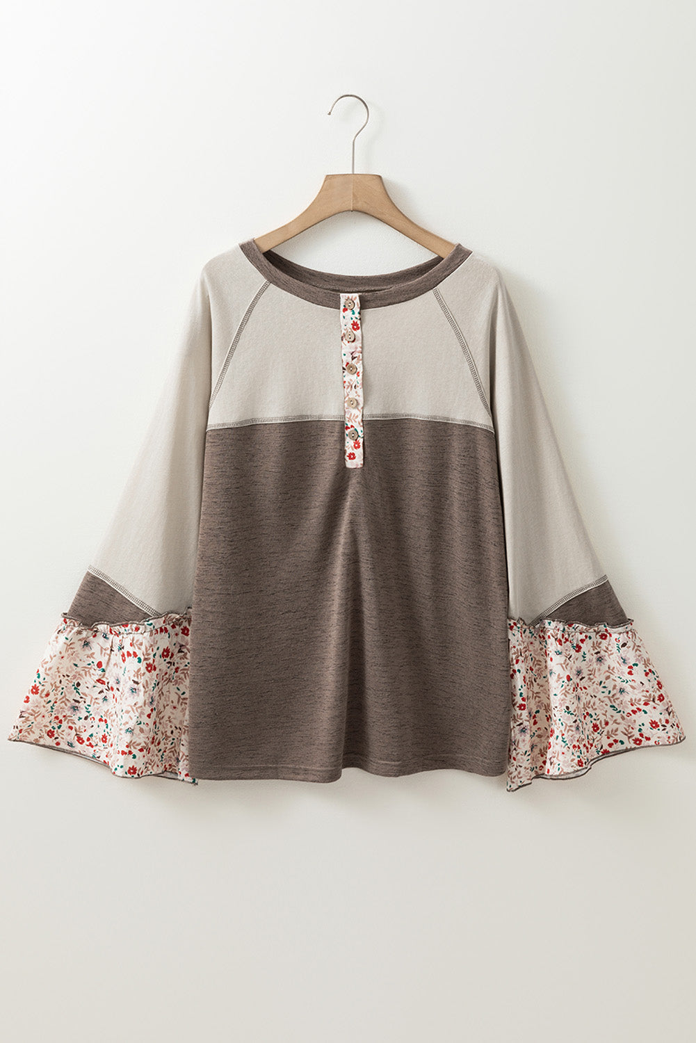 Floral half button long sleeve T-shirt with opaque fabric and floral details.