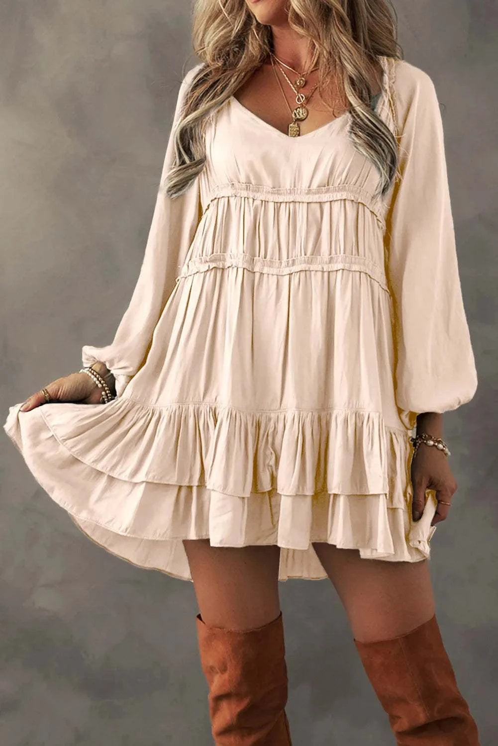 Frill ruffled V-neck long sleeve mini dress in beige.