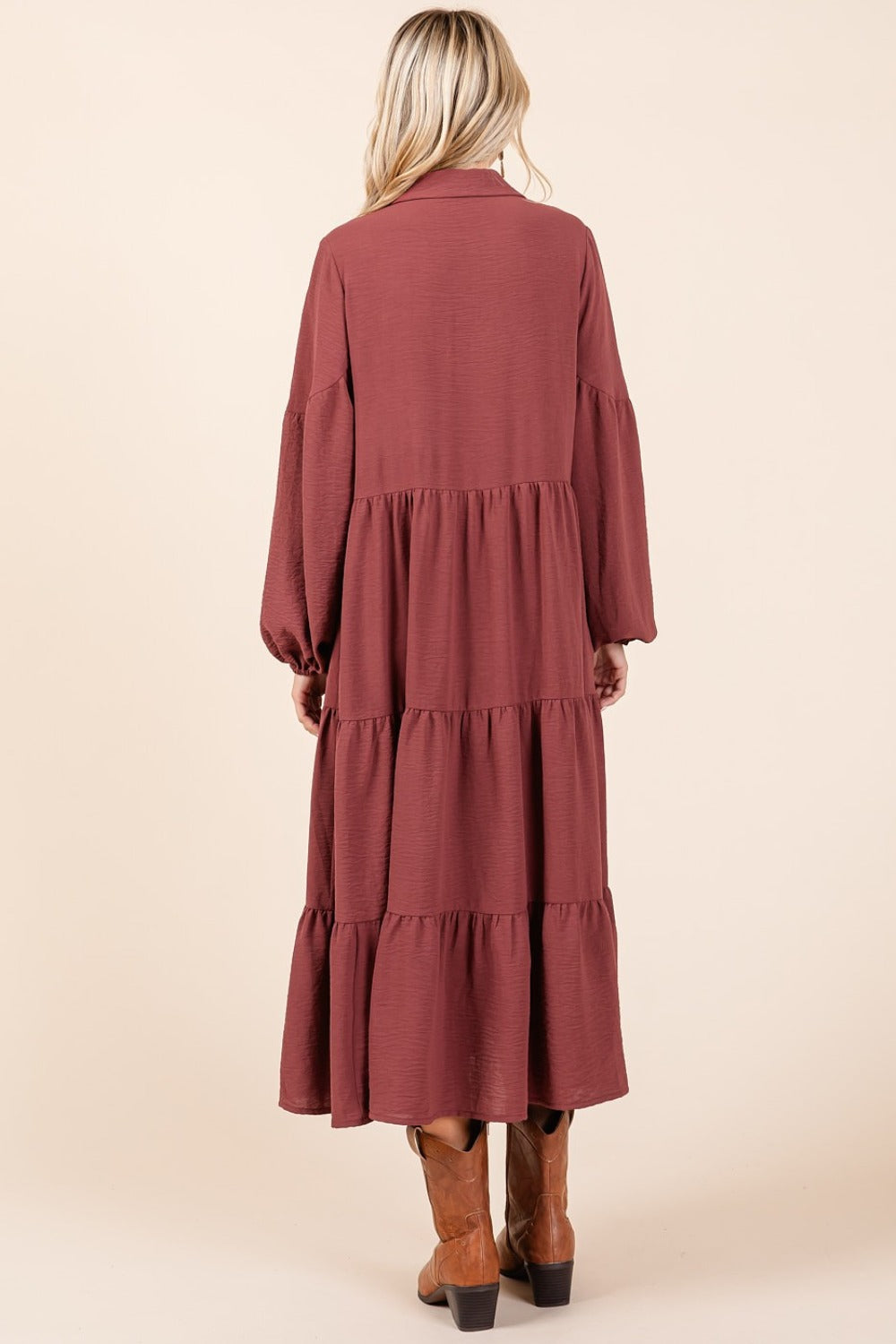 Tiered button down long sleeve midi dress in red-brown with a tiered design.