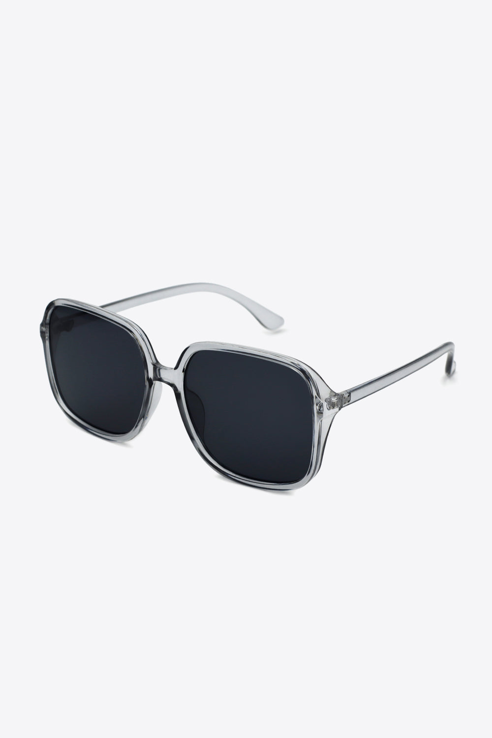 Oversized square sunglasses with UV400 protection and polycarbonate frame.