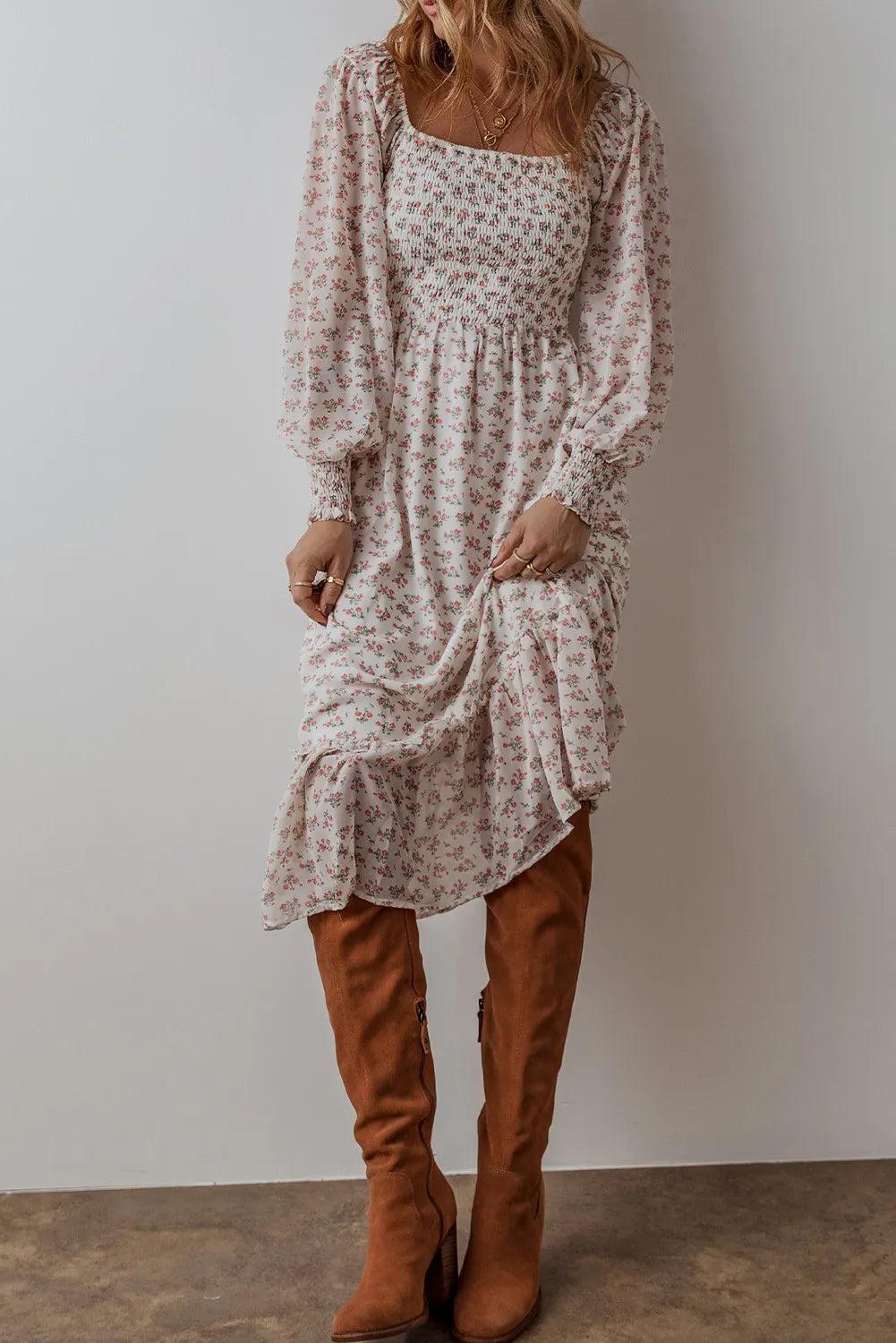 Smocked floral square neck long sleeve midi dress with ruffled hem.