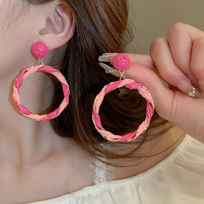 Twisted Contrast Grass Vine Earrings made of alloy, featuring vibrant pink and orange twisted design.