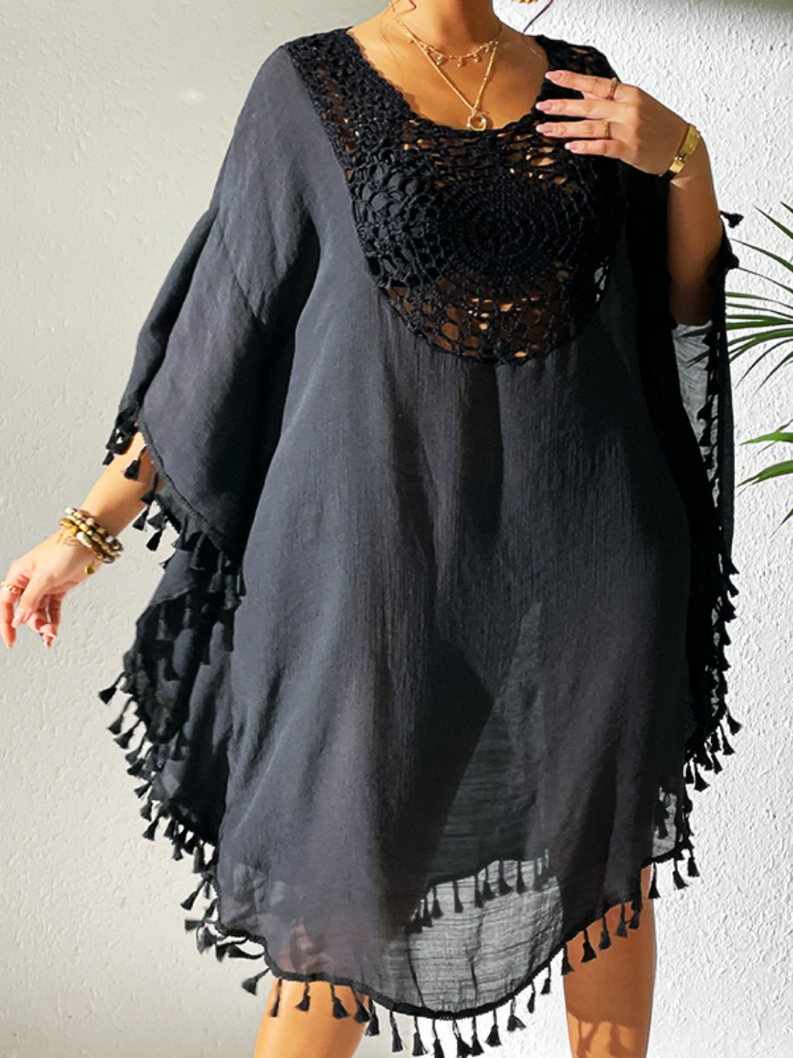 Tassel cutout scoop neck semi-sheer cover-up dress in black.