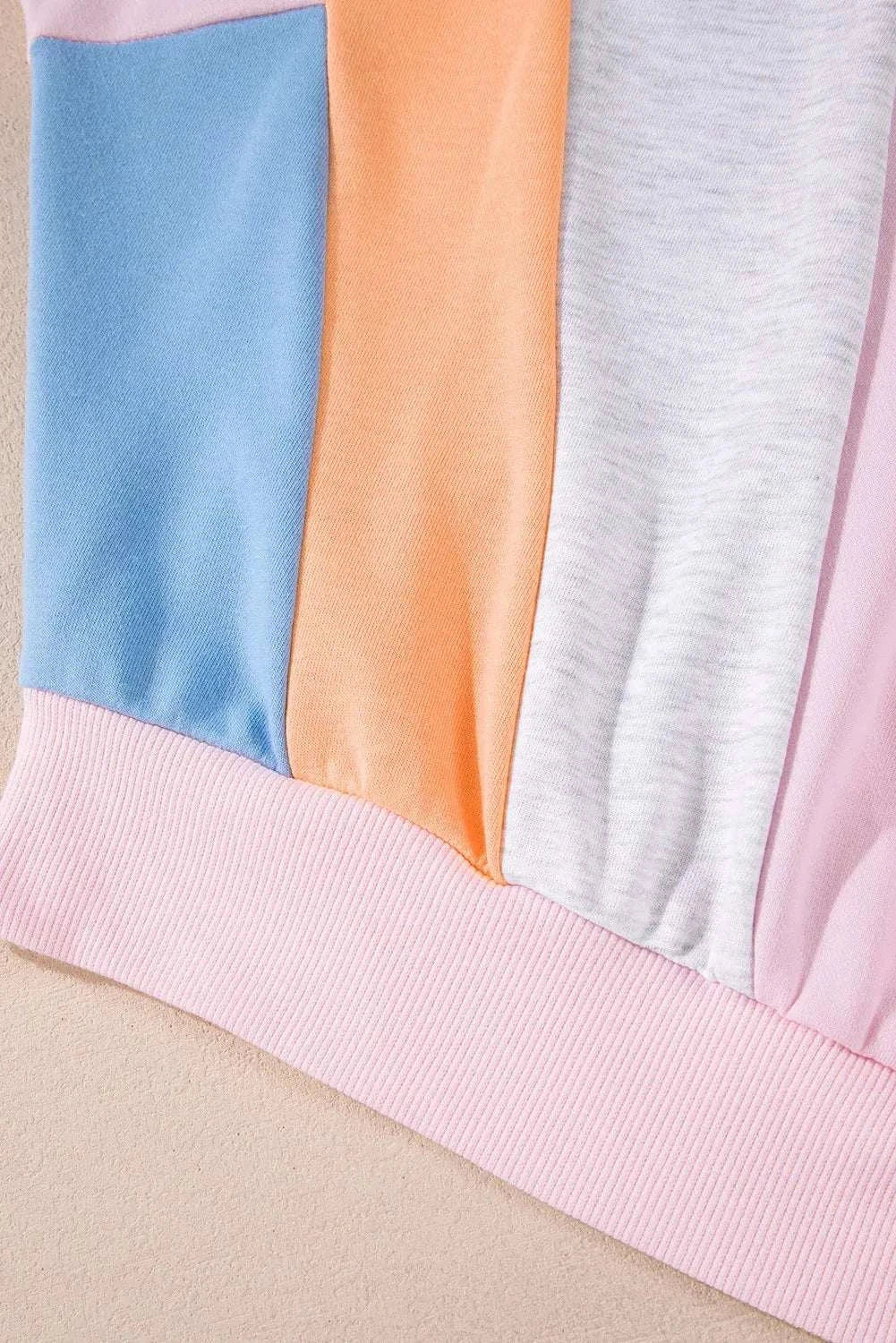 Color block round neck sweatshirt with long sleeves, showcasing pastel panels.