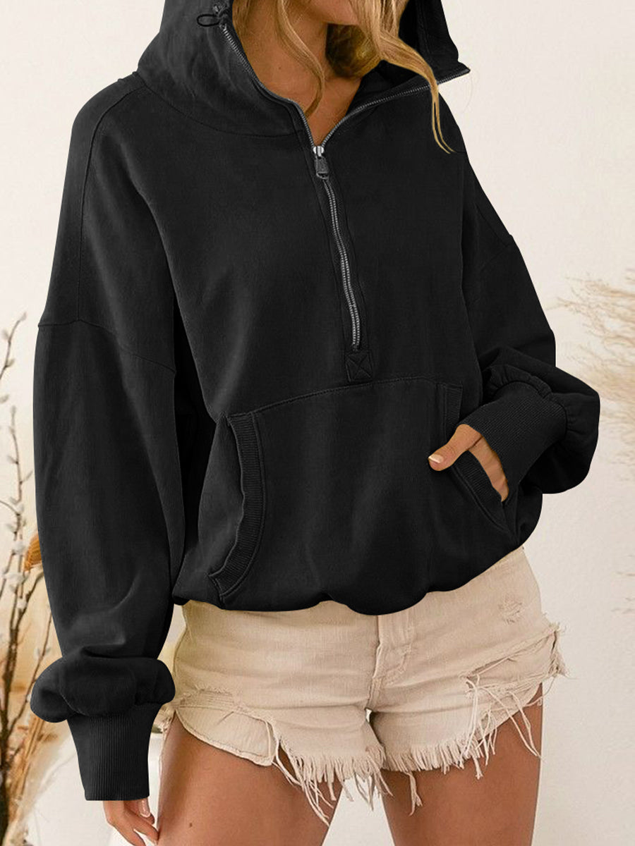 Black zip-up dropped shoulder hoodie with pockets, drawstring, and relaxed fit.