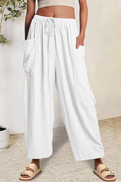 Boho wide leg harem pants with pockets in white.