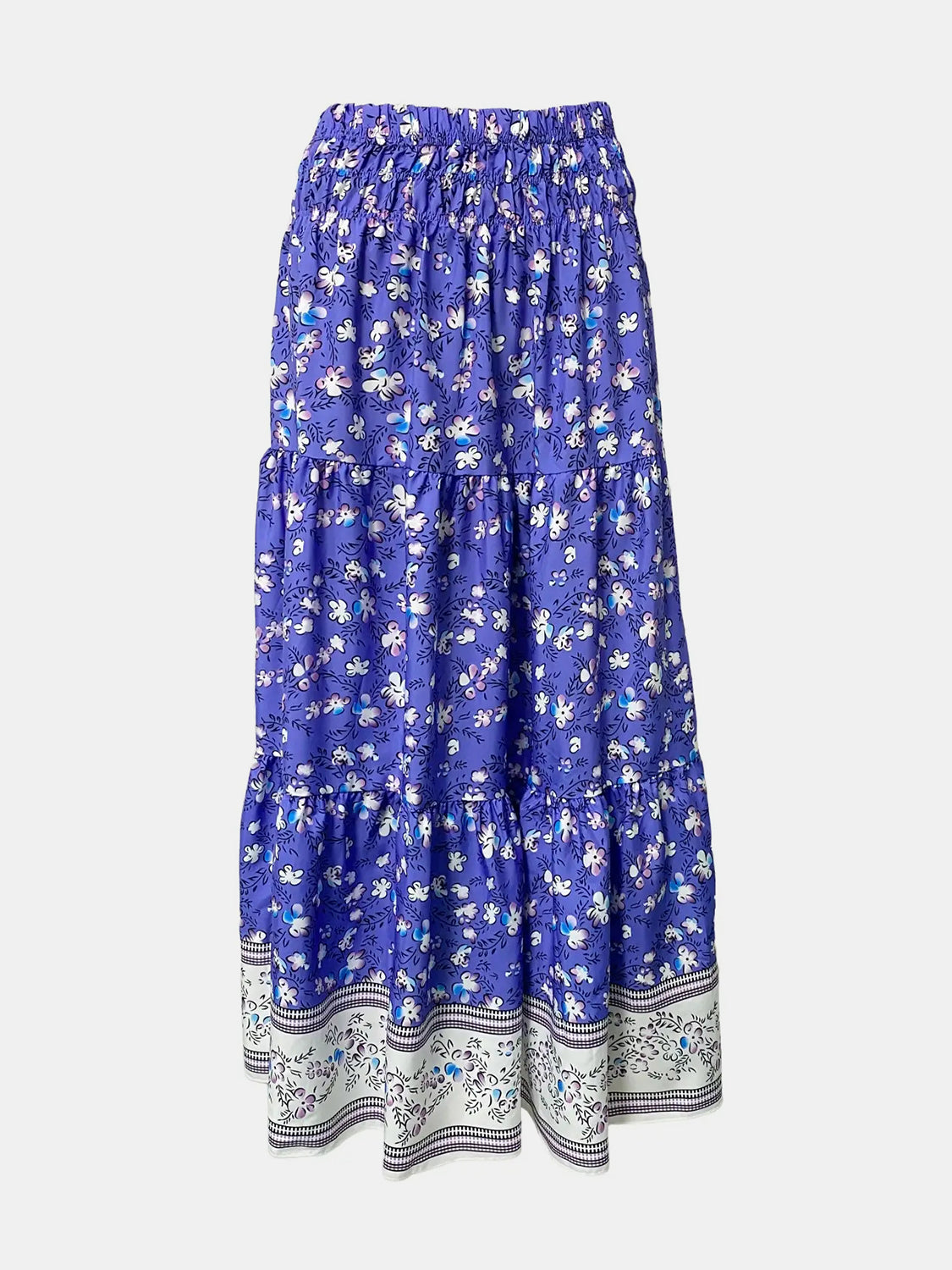 Tiered printed elastic waist skirt with a ruched design, made of 100% polyester.