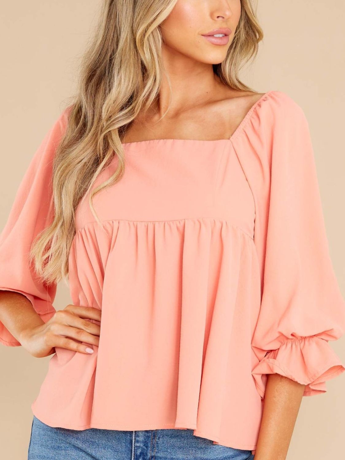 Smocked square neck flounce sleeve blouse in peach, ruffled design, no stretch, polyester material.