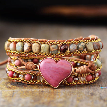 Crystal Bead Bracelet with Natural Stones and Heart Pendant on Wooden Surface