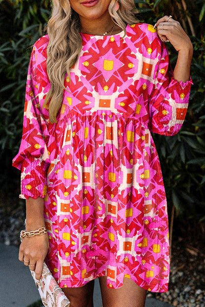 Pink geometric print smocked long sleeve mini dress with bohemian charm and shirred detailing, perfect for spring and autumn.