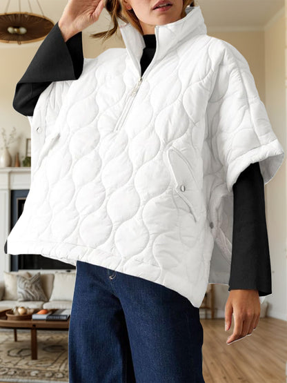 Textured half zip pullover poncho in white, featuring a quilted design.