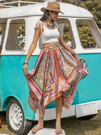 Printed high waist handkerchief hem skirt with vibrant patterns.