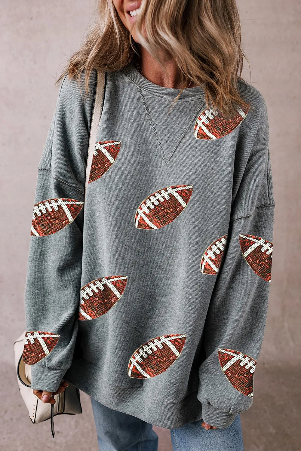 Sequin football design round neck long sleeve sweatshirt in grey.