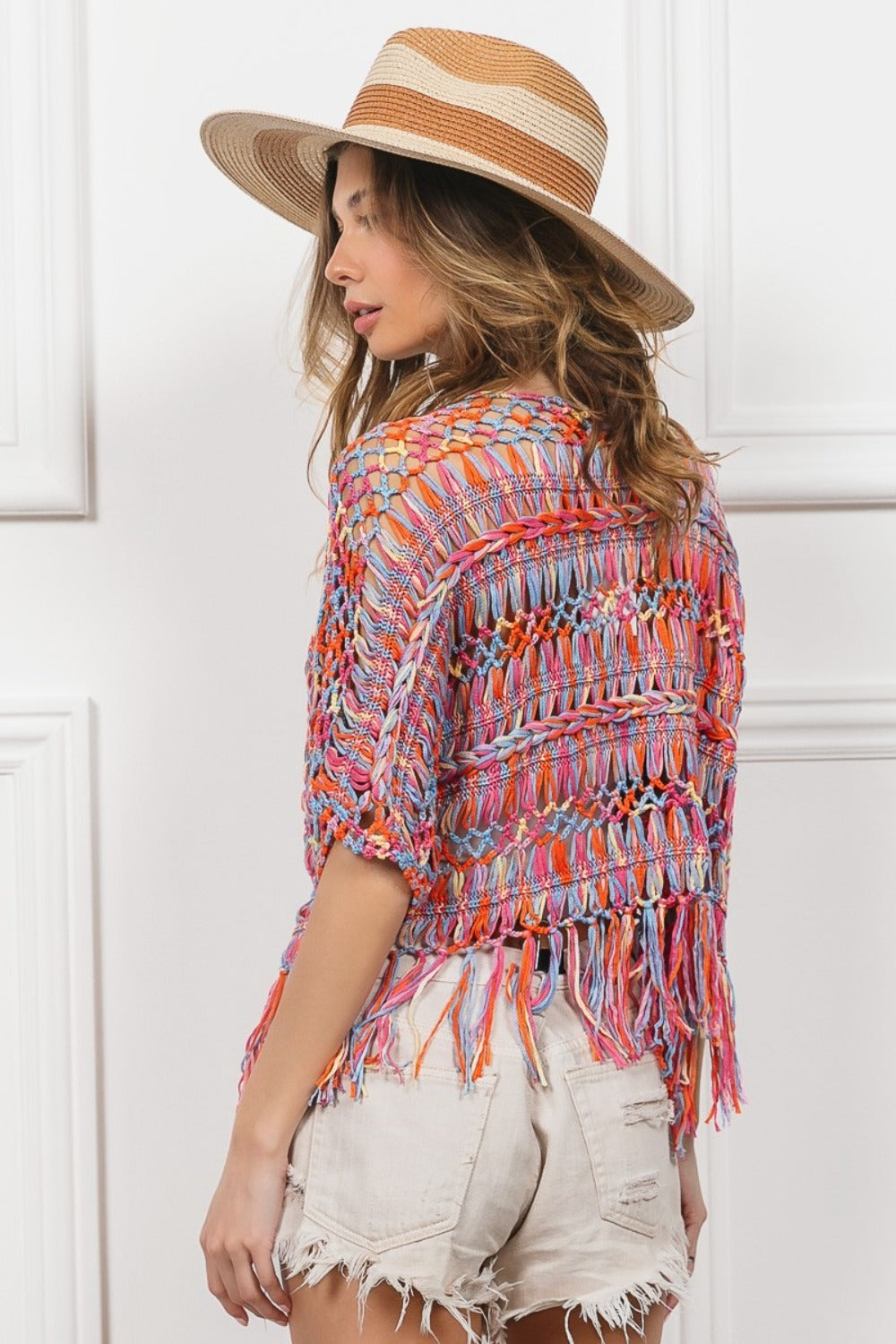 Open Front Fringed Crop Knit Cardigan with colorful cable knit design and playful fringes, perfect for layering over outfits.