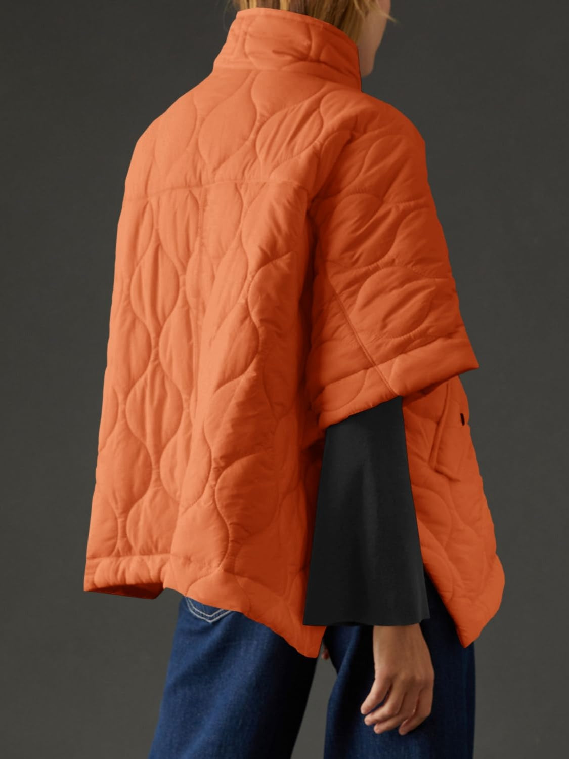 Textured half zip pullover poncho in orange, featuring a basic style and lined body made of 100% polyester.