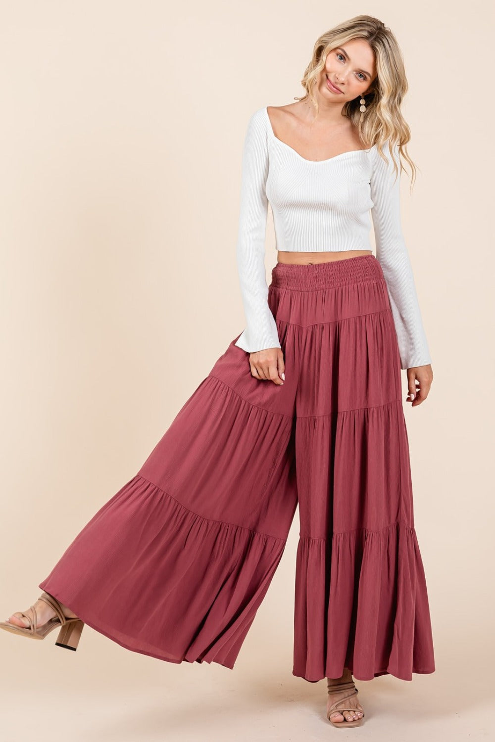 Tier detail smocked elastic waist wide leg pants in lightweight crepe, featuring a flowy silhouette and side pockets.