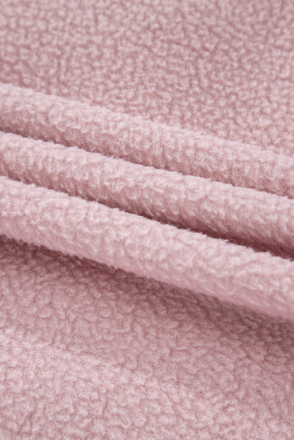 Close-up of pink fleece fabric from a Half Snap Long Sleeve Fleece Jacket.