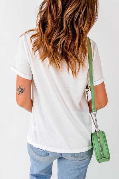 Back view of a woman's White Cherry Graphic T-Shirt with a green bag.