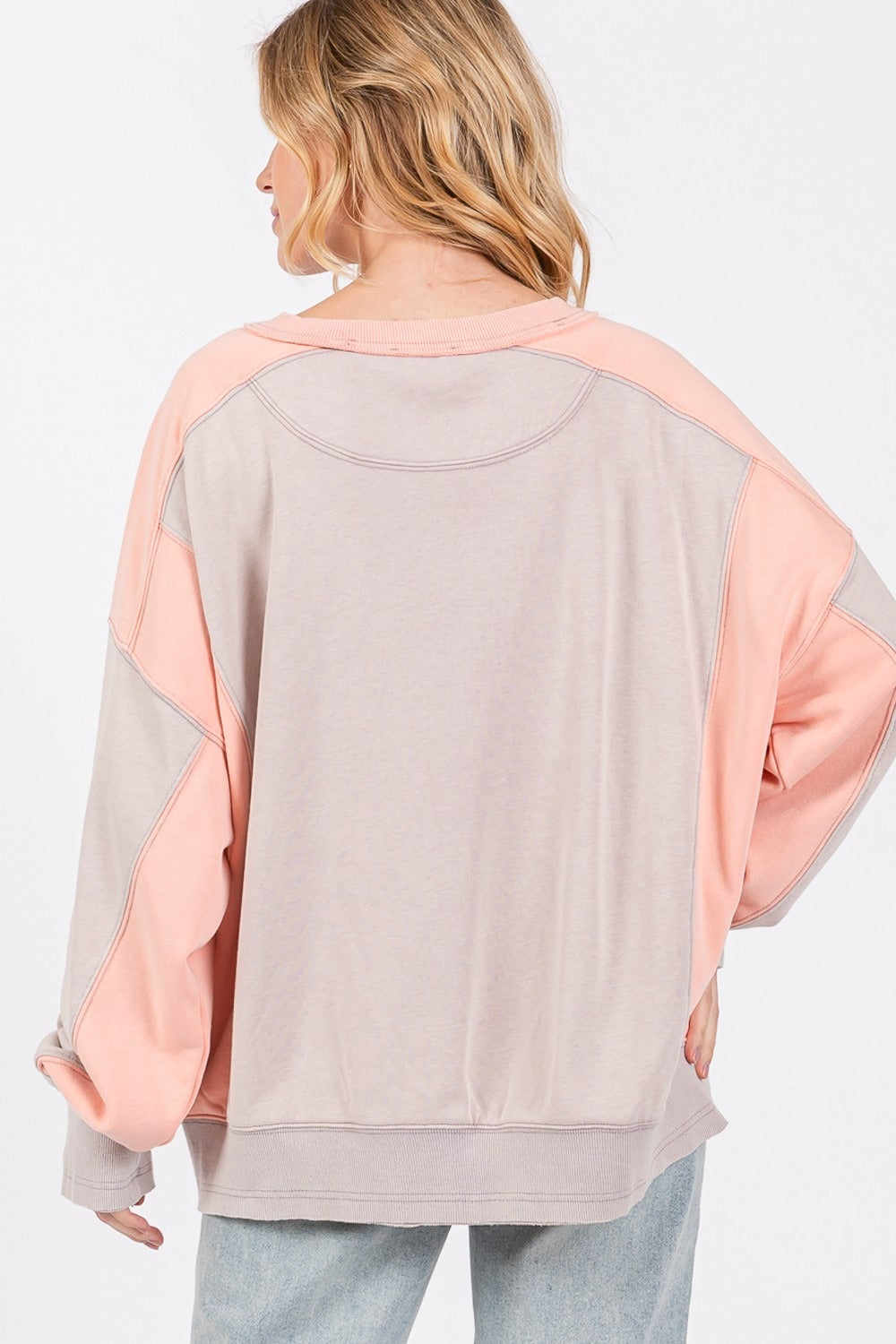 Colorblock round neck relaxed fit sweatshirt with dropped sleeves and ribbed trim.