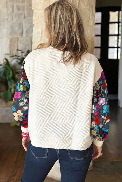 Plus size texture printed round neck long sleeve blouse with floral sleeves.