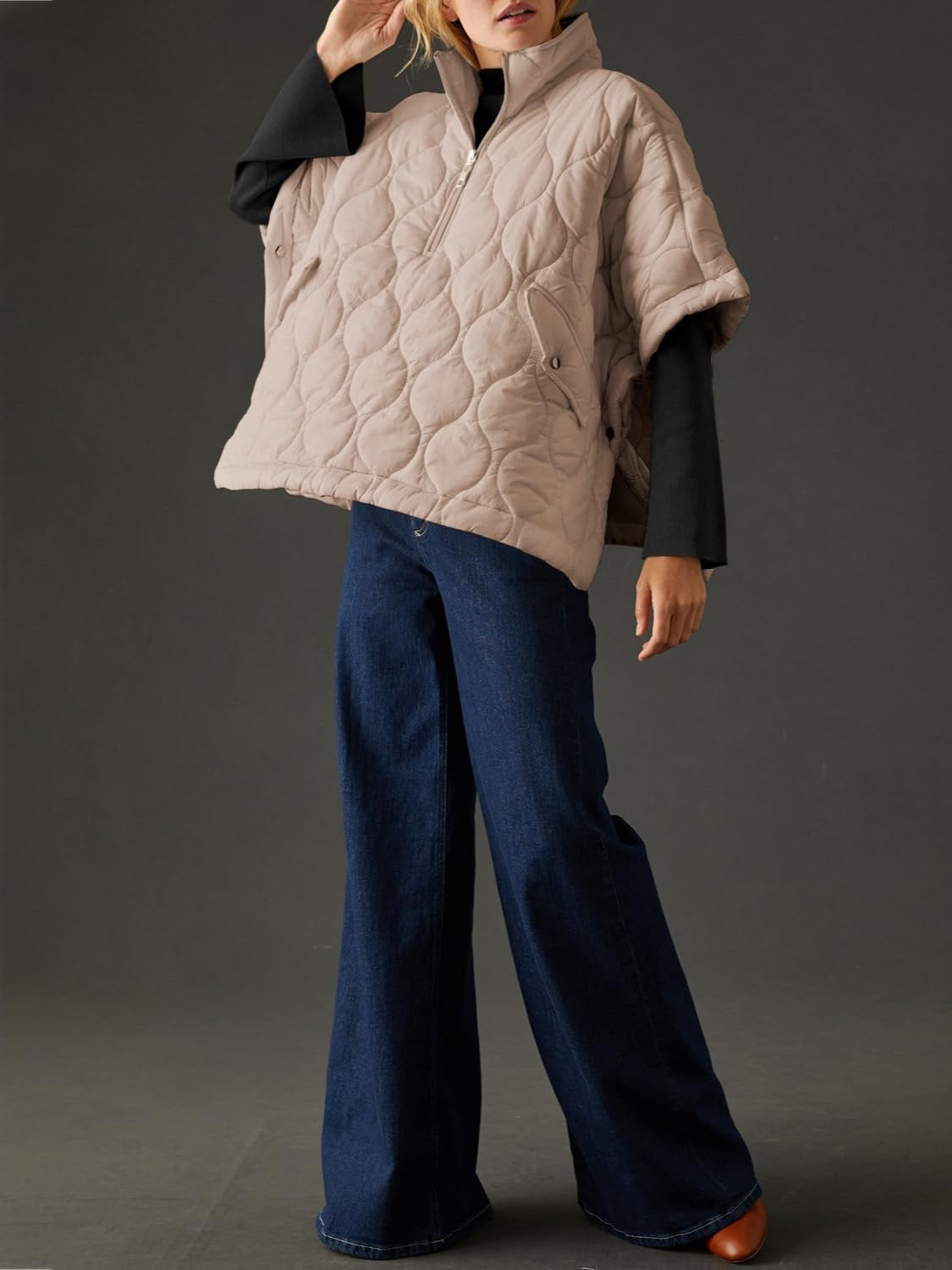 Textured half zip pullover poncho in beige with quilted design.